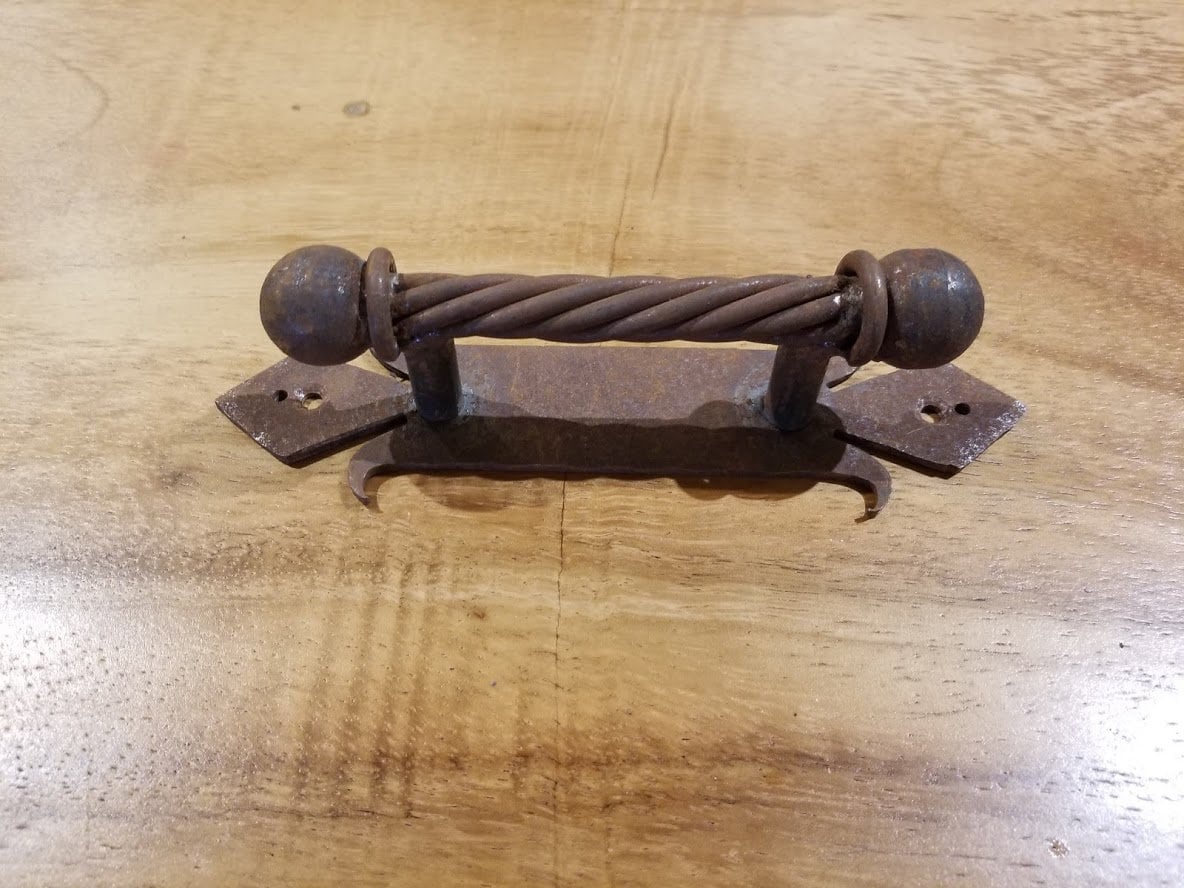 Iron twist ball handle