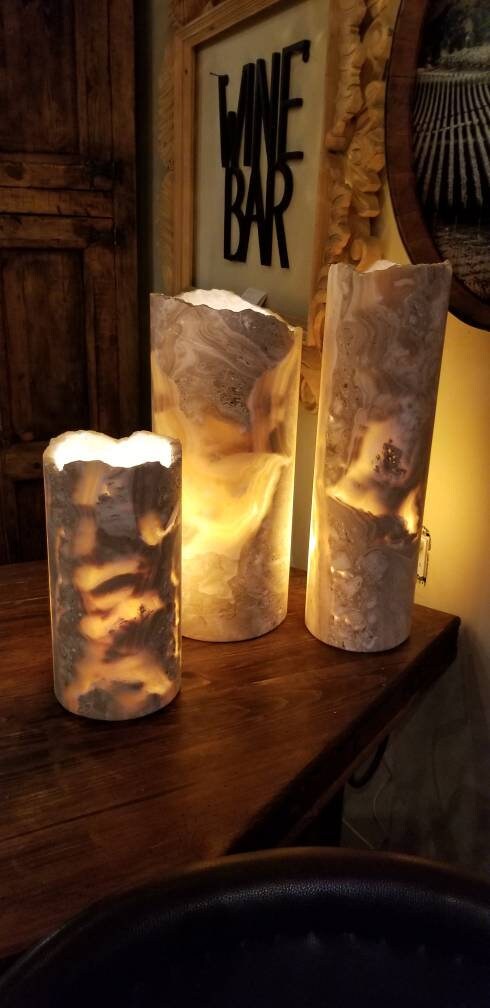 Onyx cylinder 7" x 4".  4" diameter x 7" tall onyx stone cylinder.  No electrical.  Made for candles or bulbs.  Open on the top and bottom.